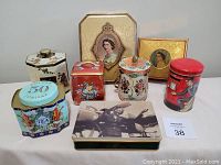 Front view of all eight collectible tins arranged together showing variety of sizes and colors