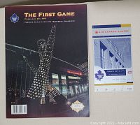 Program 'The First Game' cover from February 20, 1999 depicting the Air Canada Centre and the Maple Leafs vs Montreal Canadiens game, plus the original ticket from the same game