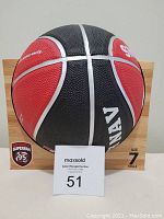 Front angle of basketball in packaging with visible 'NAV' and 'Superfan 95' logo.