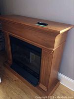 Front view of fireplace mantel and insert