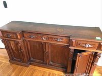 Front view of sideboard with closed drawers and doors