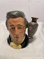 Front view of Sir Henry Doulton character jug showing bust and jug handle