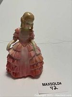 Front view of Royal Doulton Rose HN1368 porcelain figurine showing details of dress and figure.