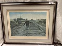 Framed limited edition print titled "After School" showing a child walking on railroad tracks in rural setting.