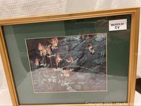 Full view of framed print showing the Ruby Throated hummingbird and flowers with green matting and light wood frame.