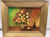 Full view of the oil painting showcasing a floral arrangement in a vase with a wooden frame.
