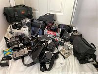 Group of assorted cameras and accessories
