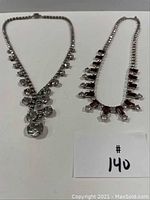 Both vintage rhinestone necklaces displayed on a white background with lot number card visible.