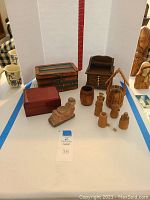 Overview of all wooden items and container of foreign coins