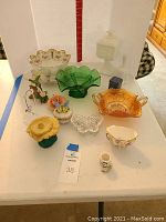 Photo of all decorative items including berry bowl, candy dishes, and various small ceramics on a white surface