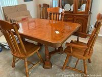 Full view of table and chairs showing overall set.