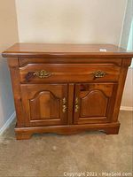 Front view of buffet showing top surface, drawer, and doors