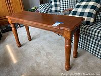 View of the oak sofa table showing the scalloped edges and carved legs.