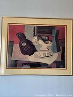 Full view of framed Picasso print with still life and guitar