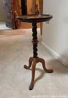 Full view of the Tomlinson pie crust pedestal table showing the round top, spiral central column, and three-footed base.