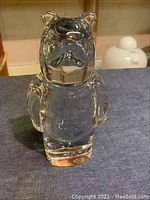 Front view of clear crystal standing bear figurine showing detailed face and arms.
