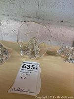 Front view of clear crystal turkey figurine, showing fan tail and body shape.