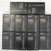 Ten boxed ATMOKO Sonic Power toothbrushes arranged in two rows