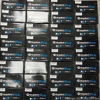 Multiple boxed NinjaBatt Pro laptop batteries arranged in rows, each box labeled with 3500mAh capacity and NinjaBatt branding.