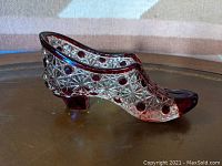 Side angled view showing detailed Daisy & Button pattern with ruby flashed circular buttons and a low heel.