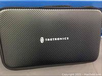 Closed black TaoTronics branded hard carrying case with zip closure, textured finish.