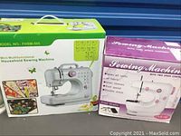 Two sewing machine boxes side by side; left box for FHSM-505 mini multifunction sewing machine, right box for two-speed sewing machine.