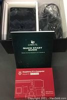 Image showing Raspberry Pi 4 box with 4GB RAM label, quick start guide, power adapter and Labists enclosure case inside open box.