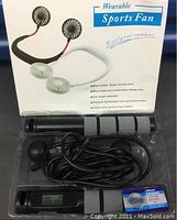 Wearable sports fan and digital skipping rope in plastic packaging with included lithium battery visible.