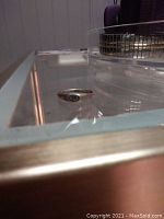 Silver ring with engraved design or marking