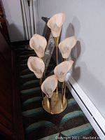 Full view of lamp showing six calla lily shades, brass base and stems