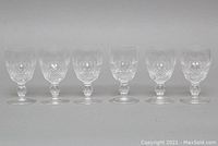 Full view of six Waterford Colleen crystal aperitif glasses arranged in a row showing the detailed cut crystal pattern