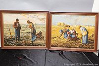 Both framed needlepoint artworks displayed side by side on a black draped surface showing the overall appearance and condition of frames and needlepoint scenes.