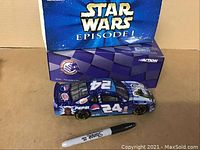 Star Wars Episode I NASCAR diecast car in box, Pepsi and number 24 on side, Sharpie marker for scale comparison