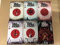Front cover view of all six issues of Old Man Logan comics arranged in two rows of three showing minimalist weapon designs and series titles.