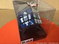 Photo shows Toronto Maple Leafs Rubik's Cube in original clear plastic display box, sealed and unused.