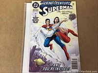 Top view of the Superman The Wedding Album #1 comic book cover showing the iconic flying wedding scene