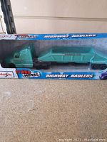 New Maisto diecast highway hauler toy truck in original box with trailer marked Gravel Co.