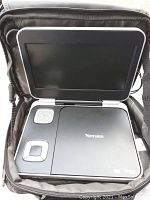 Venturer portable DVD player open, showing screen, built-in speaker, and control buttons.