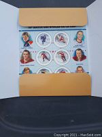Inside view of the commemorative postage stamp sheet featuring NHL players and hockey scenes from the 50th All-Star Game.