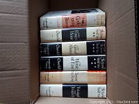 Photo of six Winston Churchill hardcover books from 'The Second World War' series in a box showing the spines and dust jackets.