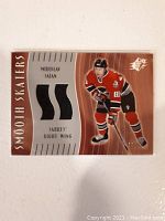 Front view of 2002 Upper Deck SPX Smooth Skaters Miroslav Satan hockey card showing player image, branding, and embedded game-used fabric patch.