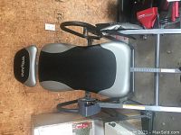 Side view of the Innova inversion table showing padded backrest, headrest, and handles