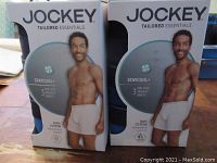 Two unopened boxes of Jockey Tailored Essentials boxer briefs showing front packaging with model image
