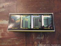 Side view of the box showing images and years of the four tractor models included: Waterloo Boy, Model G, Model M, and Model R.