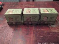 Front view showing three boxed units of Kiss Beauty 99% Aloe Vera Colour Changing Lipstick, each box containing 12 lipsticks.