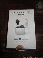 Closed packaging box showing image of earbuds and charging case, Klipsch branding, Bluetooth 5 icon, aptX and AAC logos.