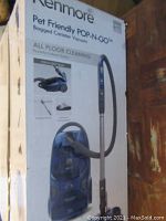 Front of box showing Kenmore Pet Friendly Pop-N-Go Bagged Canister Vacuum promotional image