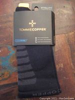 Packaged Tommie Copper men's Vitality Compression Socks in black with CoolCopper technology label visible.
