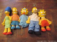 Front view of the complete set of five Simpsons Family plush dolls from Burger King.