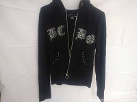 Front view of black BCBGMAXAZRIA hoodie with visible 'BCBG' sequin embroidery and front pockets.